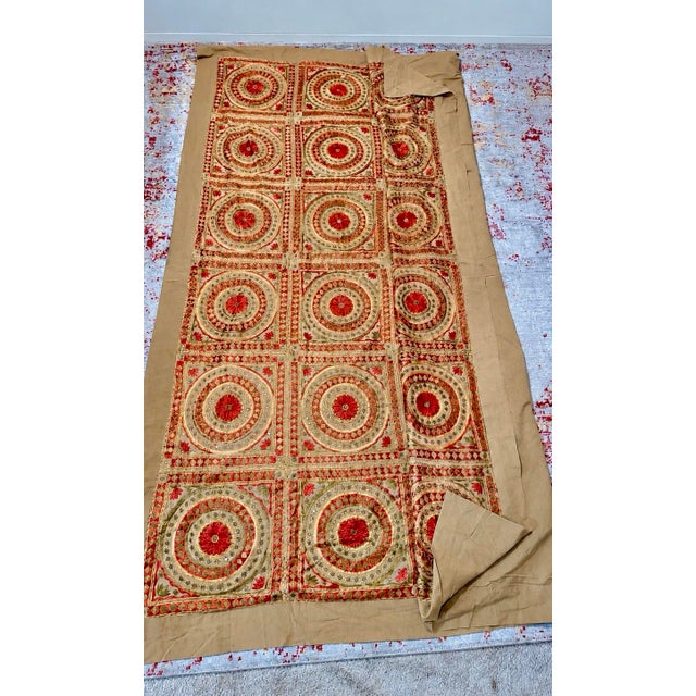 Hand-embroidered silk coverlet from India, likely Gujarat or Rajasthan, mid-to-late 20th century. A grid of concentric...