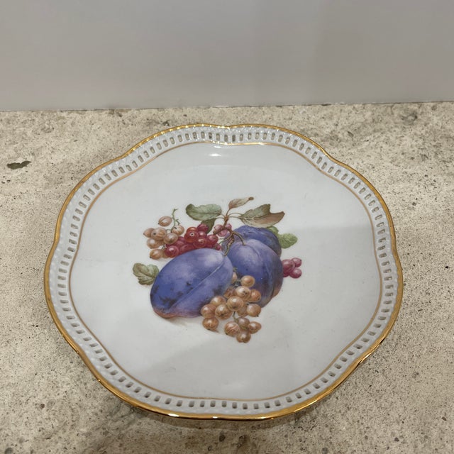 The Vintage Schumann Arzberg Germany Bavaria Porcelain Reticulated Rim Fruit Plate is a charming and collectible piece of...