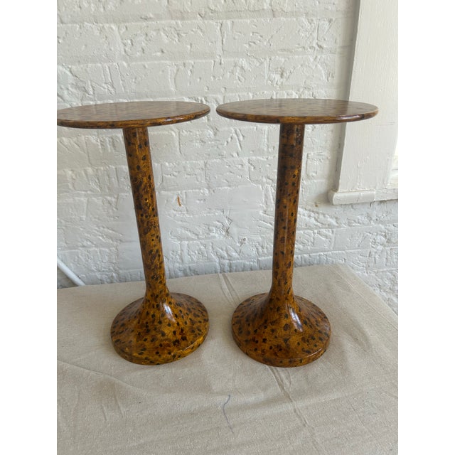 These are 2 vintage wooden drink tables painted in a signature tortoiseshell finish by E. Lee Jahncke Mead of New Orleans....