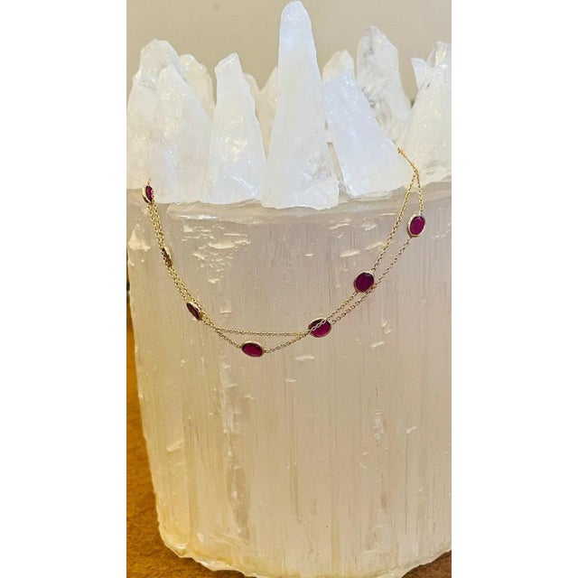 This Ruby Chain Bracelet in 18K gold showcases 1.78 carats of endlessly sparkling natural ruby. It measures 7 inches long...