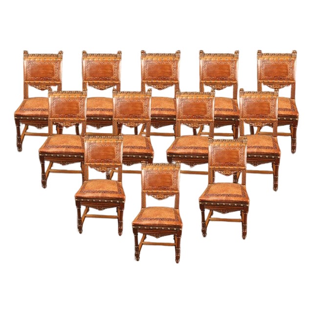 Set of 12 Antique Italian Renaissance Style Hand-Carved Walnut Dining Chairs With Embossed Leather, Circa 1890 For Sale
