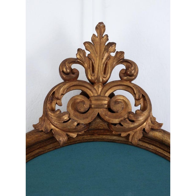 An elegant Italian bed headboard incorporating an important antique carved and gilded wooden ornament in genuine gold...