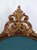 An elegant Italian bed headboard incorporating an important antique carved and gilded wooden ornament in genuine gold...