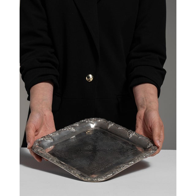 This early 20th century Baroque tray from France is finished in gray, worked in metal. Its design carries the Baroque...