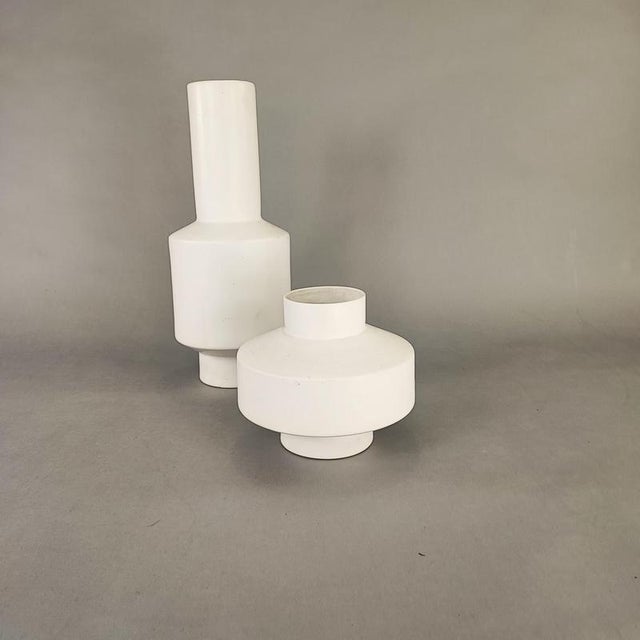 Pair of white vases with a 1970s design. Perfect vintage condition, no flaws. Design period: 1970 - 1979 Country of...