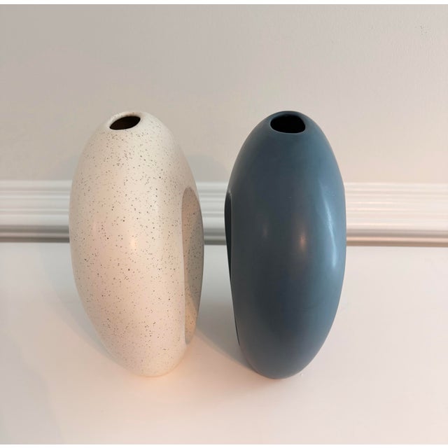 A striking pair of contemporary Portuguese ceramic vases by Sporvil Ceramics. Featuring a sculptural open-center “donut”...