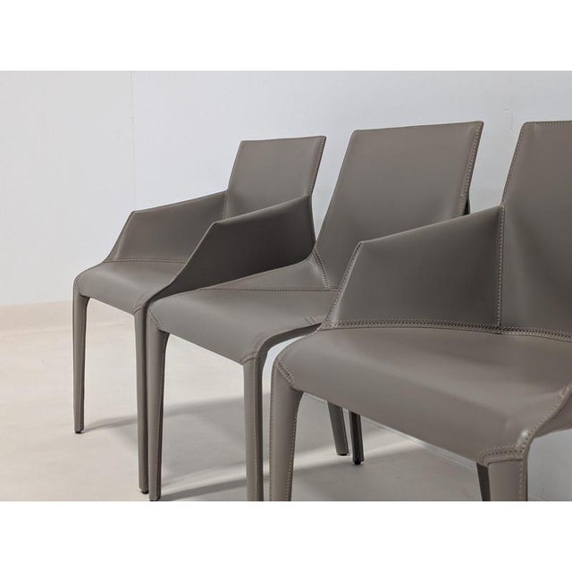 Designed by Jean-Marie Massaud for Poliform, the Seattle dining chairs feature a sophisticated, fully upholstered...