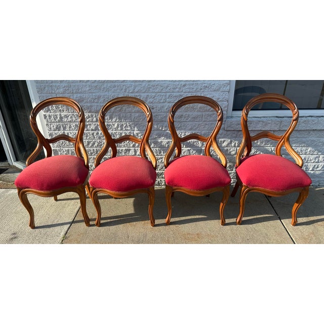 Super clean set of four Victorian chairs upholstered in a berry fabric. Quality, sturdy made chairs , each measuring 19”w...