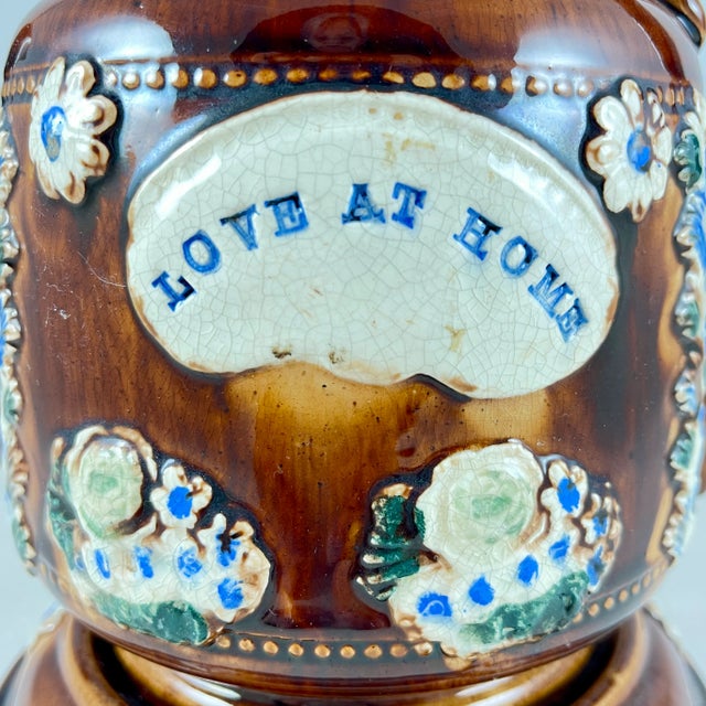 A Measham – Bargeware Teapot impressed with the saying, “Love At Home”, England, circa 1880. The three piece teapot set...