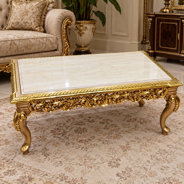 Bring timeless European elegance into your home with this beautifully ornate French Louis XV style coffee table, featuring...