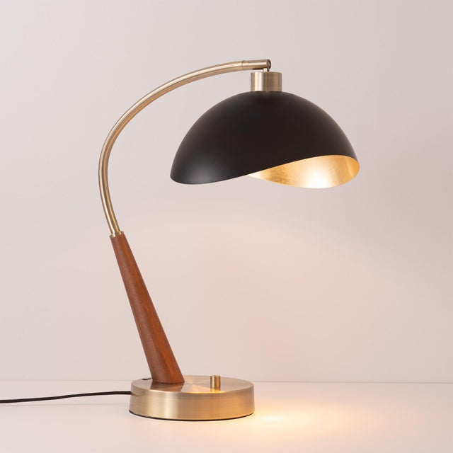 The Luna Bella Boomerang Table Lamp is a striking piece of craftsmanship, featuring a unique half-dome shade in matte...