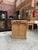This old reception counter made of solid oak has been completely restored. Its front is decorated with crooks and its top...