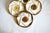 A set of 5 ceramic plates by Longchamp France. Stunning geometric brown and beige design with a central spiral motif,...