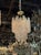 The Vintage Murano Clear and Blush Spiral Chandelier is a stunning and unique piece of lighting. The intricate spiral...