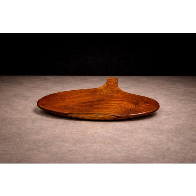 Produced by Taller Maya, this hand-carved serving board reflects a contemporary interpretation of regional woodworking...