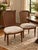 An elegant coordinating pair of vintage French Provincial side chairs featuring warm wood frames, beautifully preserved...