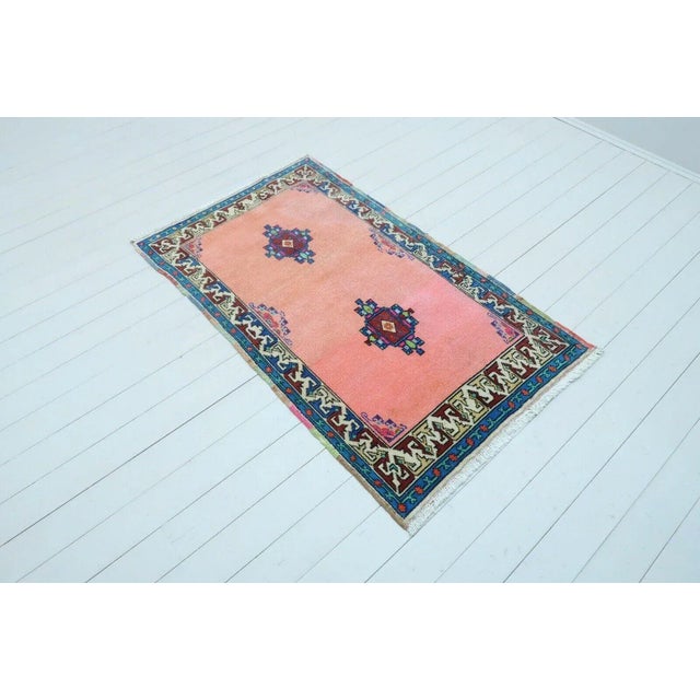 This beautiful, traditional vintage, hand knotted Turkish area rug is approximately 60 years old. It is handmade of very...