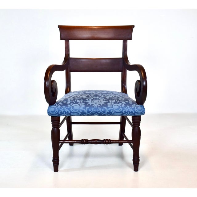 An antique English Mahogany accent armchair newly upholstered in peacock royal blue Damask with turned legs dating to the...