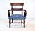An antique English Mahogany accent armchair newly upholstered in peacock royal blue Damask with turned legs dating to the...