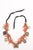 A spectacular hand beaded antique coral and metal beaded Moroccan necklace from the early 20th Century. Loose clusters of...