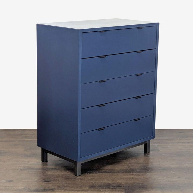 This Room & Board dresser features a modern blue finish and clean lines, making it a stylish match for any bedroom. It...