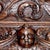 This valuable ancient noble 16th century Ligurian carved oak and chestnut Bambocci credenza features a display cabinet. It...