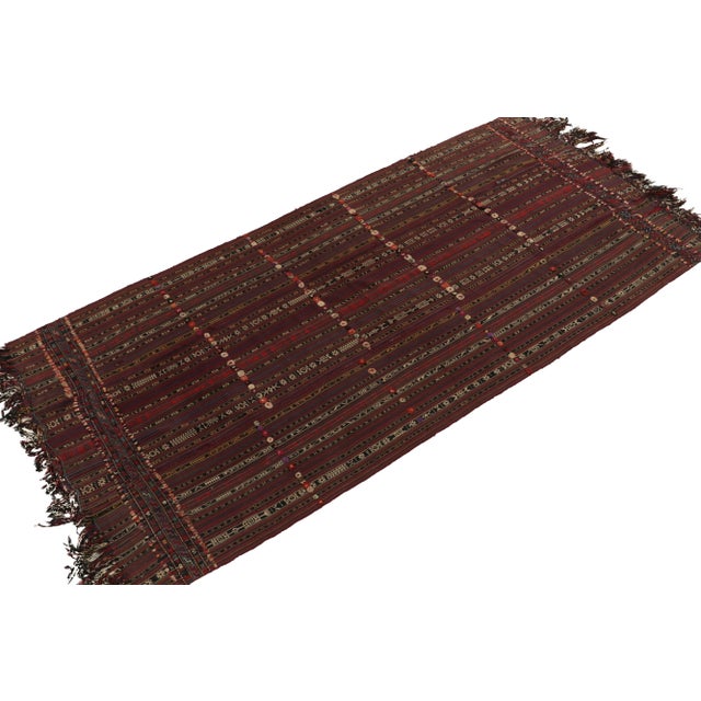 Handwoven in wool, a 5x10 Persian tribal kilim originating circa 1950-1960. This particular rug style showcases a unique...