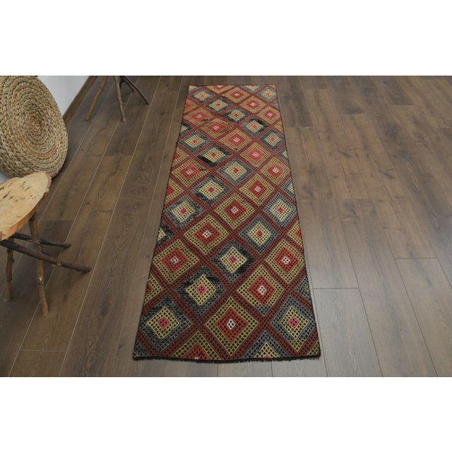 Vintage Turkish Hand-Knotted vintage rug is a semi-antique vintage runner rug. The '70s Eastern region of Turkey's unique...