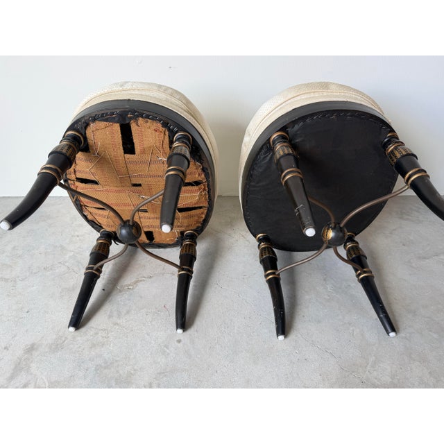 Pair of Vintage Hollywood Regency Black & Gold Ebonized Ottomans With Brass “X” Stretcher Base and Tufted Cushions For Sale In Miami - Image 6 of 12
