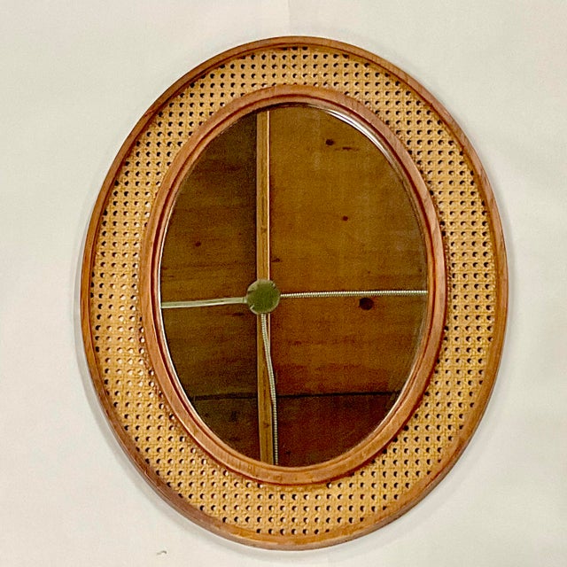 We love this Mid-Century Wall Mirror. It's in the style of Sirocco featuring a Faux Cane frame hosting a large oval...