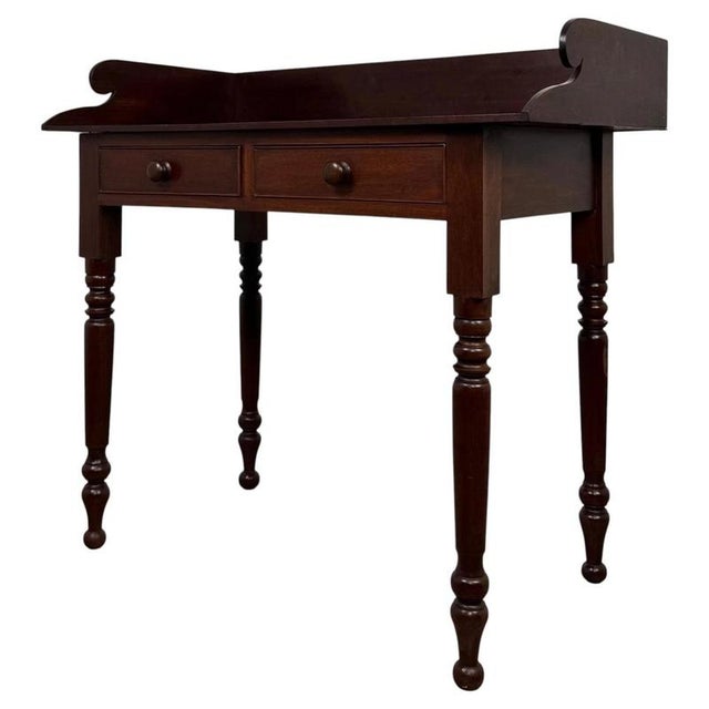 A charming and beautifully proportioned 19th-century victorian mahogany writing table, combining elegant period styling,...