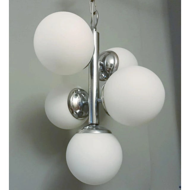 Vintage Italian pendant chandelier with a cluster of five matte white opaline glass globes mounted on chrome structure /...