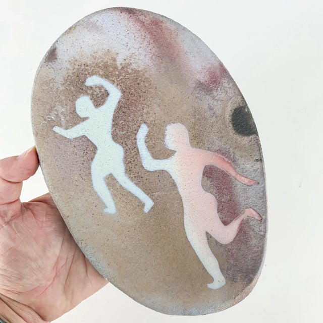 Fabulous vintage handmade pottery wall hanging with dancing figures. Love the blue, purple and grey colors. Hook on back...