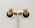 1970s oval domed top with off-white round disc drop with smaller black round disc on top of that and smaller textured...