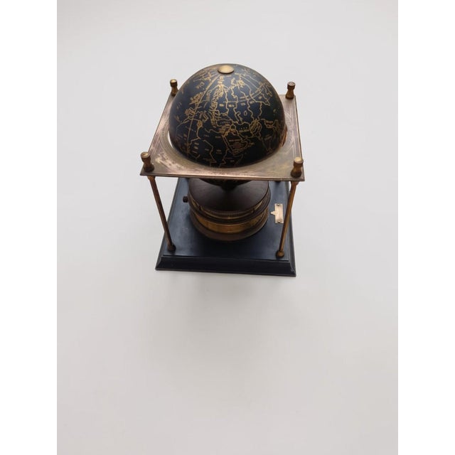 The royal geographical society world clock, arthur imhof, la chaux-de-fonds, switzerland "globe" clock made of black...