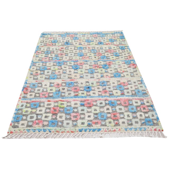 Moroccan Azilal Hi-Low texture hand knotted wool rug with geometric design.