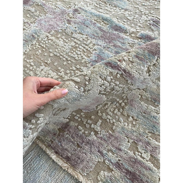 Textural silk rug in faint blues and pinks by Doris Leslie Blau. Size: 9'4" × 12'10" (284 × 391 cm). Color: ivory, taupe,...
