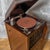 A good early 20th century wind-up gramophone set in an attractive mahogany cabinet which has a lower section for storing...