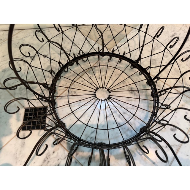 Unique eight-light round basket form wirework chandelier in the French style. The chandelier is in a black rubbed finish,...