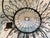 Unique eight-light round basket form wirework chandelier in the French style. The chandelier is in a black rubbed finish,...