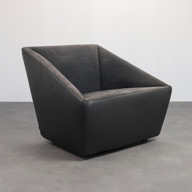A refined postmodern lounge chair produced by cor in germany during the 1990s. Defined by its clean geometric lines and...