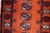 Handmade Vintage 1950s Uzbek Bukhara Runner – Wool Tribal Rug (2.6' x 9.5') Enhance your home with the timeless elegance...