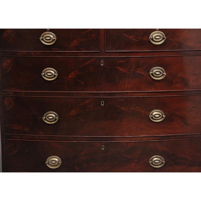 Early 19th Century mahogany bowfront chest of drawers of nice proportions, having a lovely figured top above a selection...