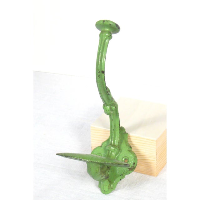 Large antique wall hook painted green. This is a double hook used for coat and hat. When mounted on wall, the hook...