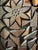 A wood carved panel that feels reminiscent of the art by Louise Nevelson.