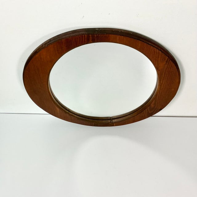 This is a wonderful Mid-Century Folk Art Mirror. Handcrafted from a single piece of pine wood, the artist created an oval...
