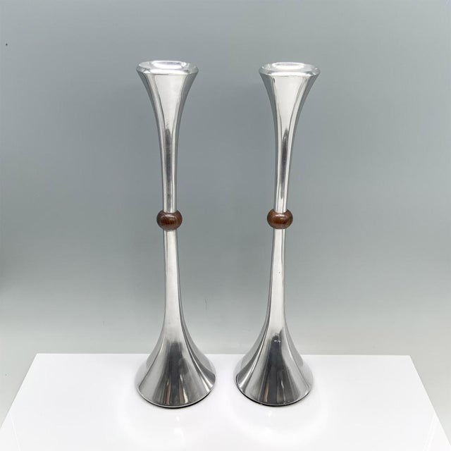 A pair of 1970’s elegant Danish metal and wood modern candlesticks designed by Jens Quistgaard for Dansk. Dimensions:...