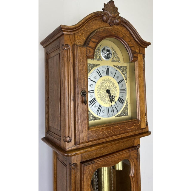 This striking vintage French Louis style grandfather clock is a beautifully crafted longcase piece, showcasing elegant...