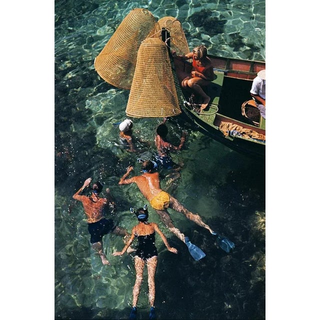 Snorkelling In Malta 1959 by Slim Aarons Slim Aarons Limited Estate Edition A group of people snorkelling off a small boat...