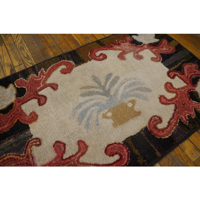 Antique American hooked rug, size: 2'5" x 4'0".